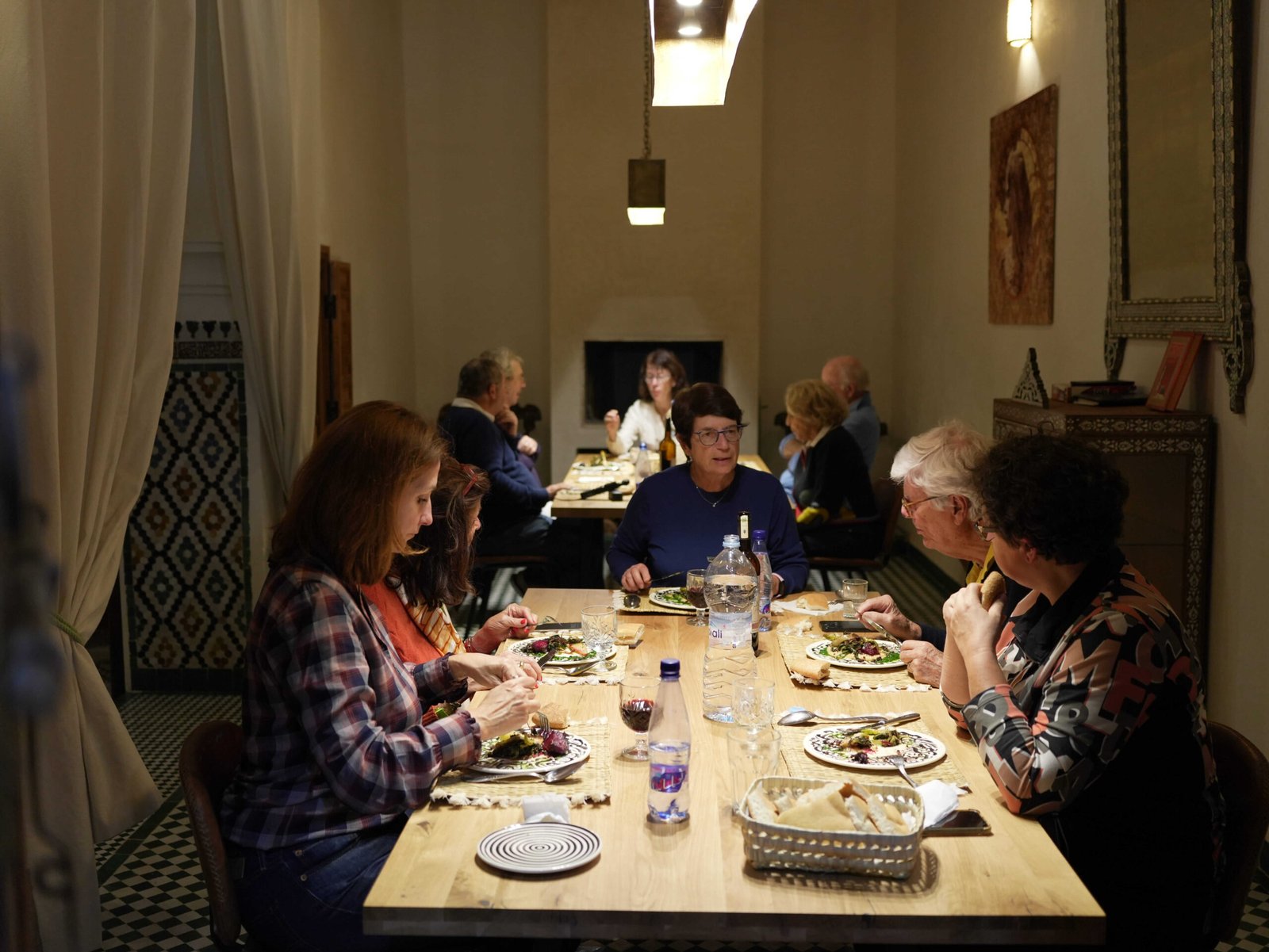 Guests sharing a meal after a Moroccan cooking workshop